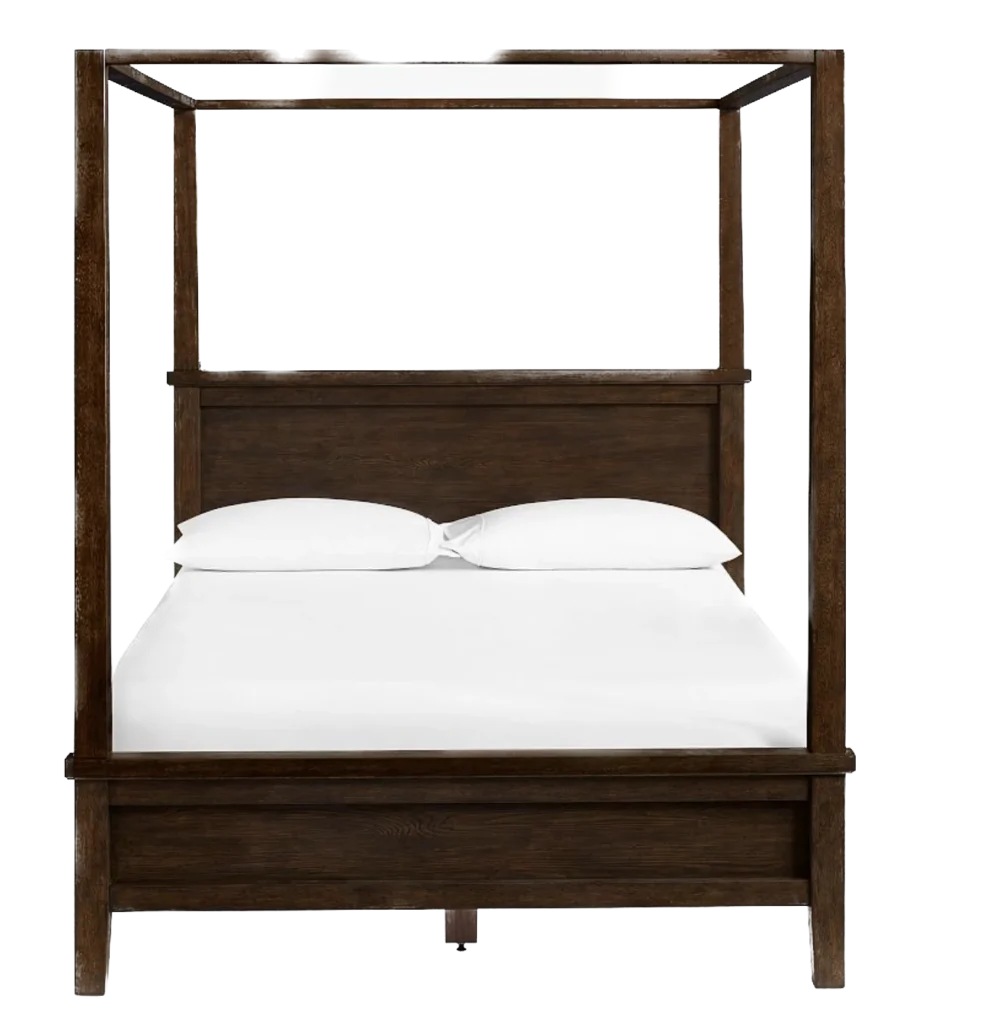 A dark brown wooden canopy bed with a headboard and white bedding.